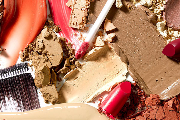 Image of crushed makeup and dried lipstick to illustrate the naturally derived products in the Tropic Makeup range